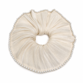 Ivory white satin pearl scrunchie featuring high-shine fabric and delicate pearl accents