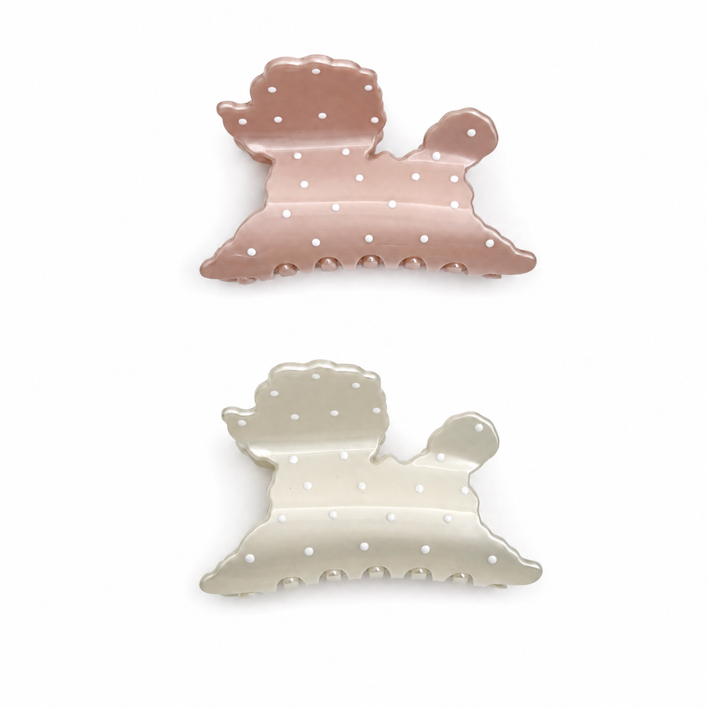 Set of two puppy-shaped polka dot claw clips in dusty rose pink and soft ivory cream