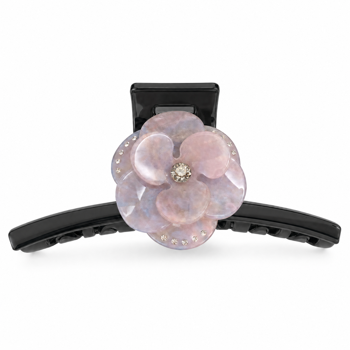 Close-up of iridescent pink resin petals and crystal rhinestone details on a large marble claw clip
