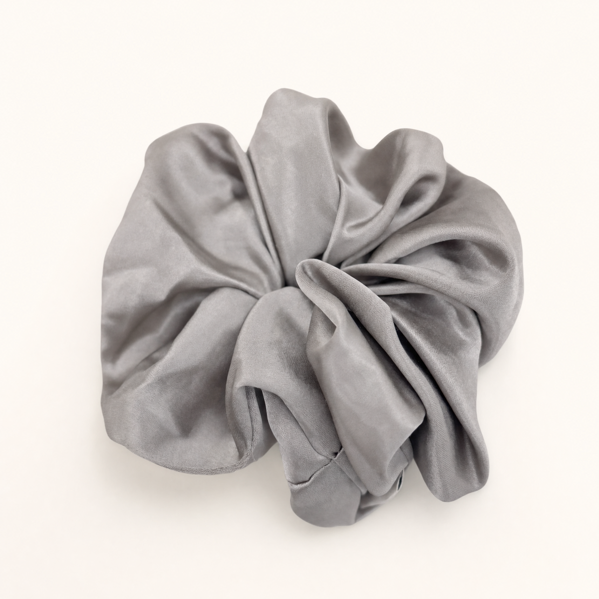 Deep dusty grey silky scrunchie designed to prevent hair breakage and creasing