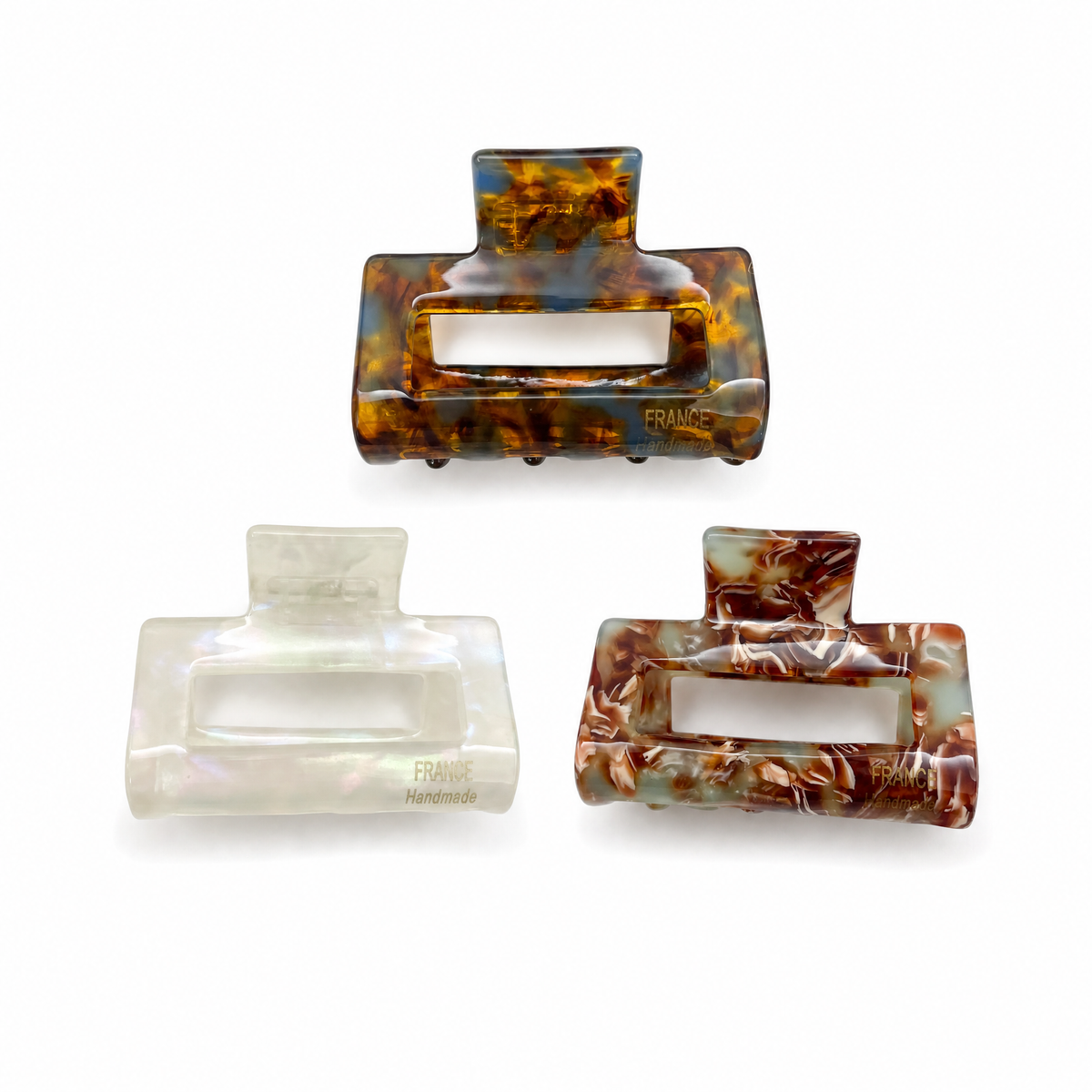 Trio set of French medium claw clips in chestnut tortoiseshell, pearl white, and honey tortoiseshell