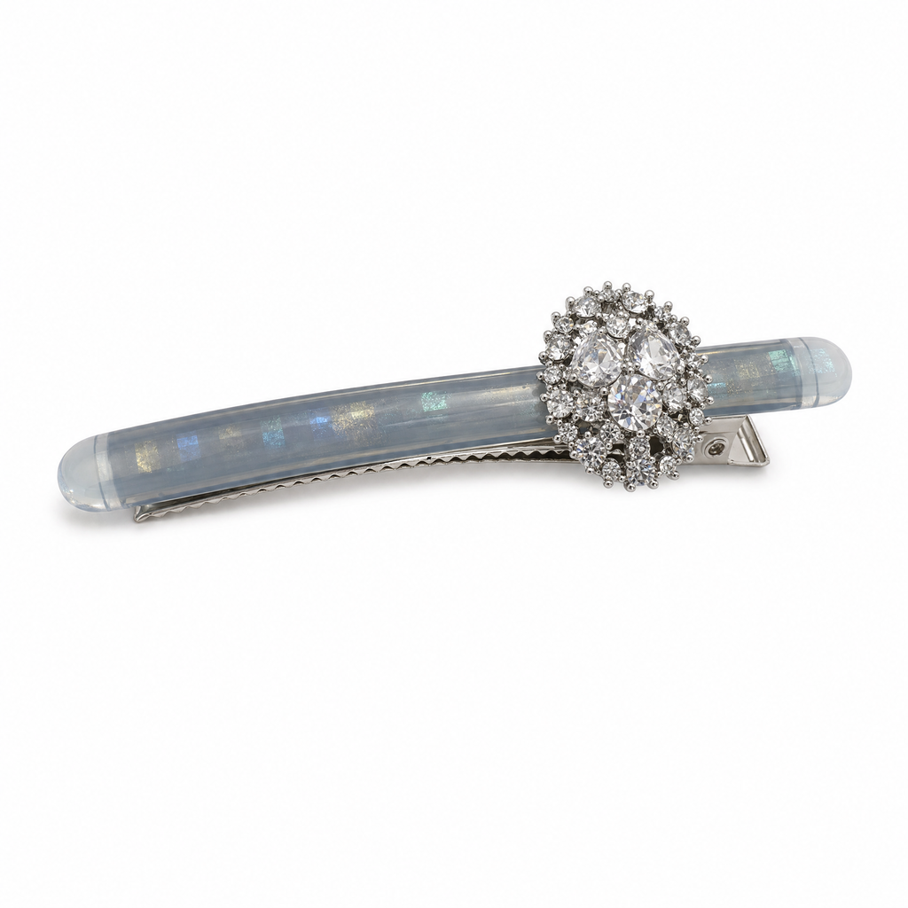 Close-up of smoky blue resin base and pave crystal rhinestones on a rectangle snap barrette clip