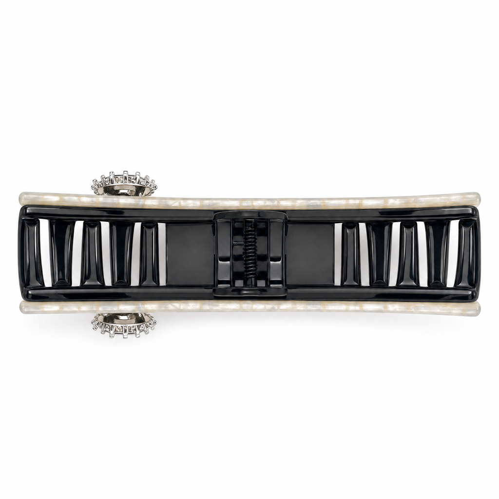 Side view of a white marble pearl hair claw clip showing durable double-row interlock teeth built for heavy, thick hair